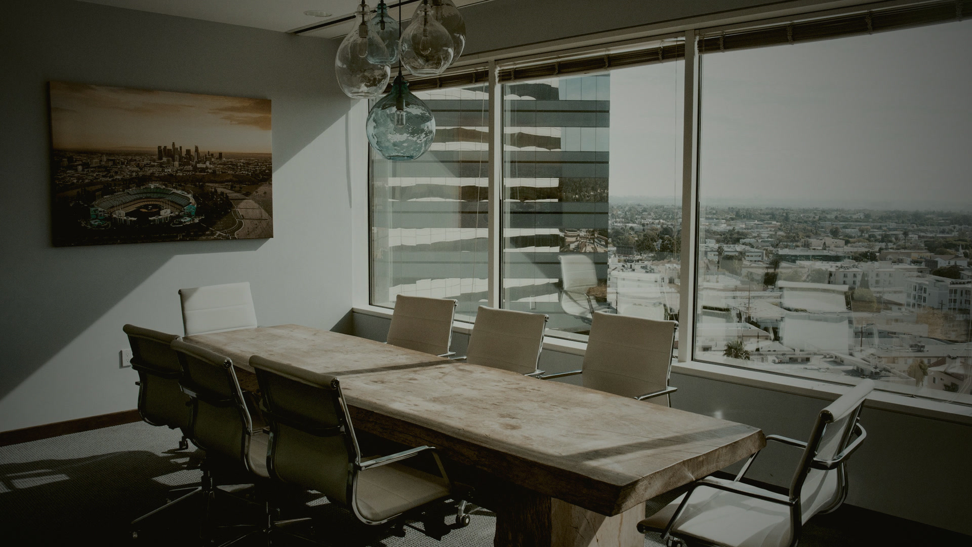 Empty wooden conference table and chairs after the room emptied.